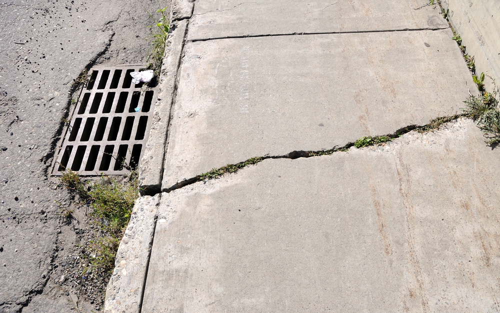 broken sidewalk concrete repair