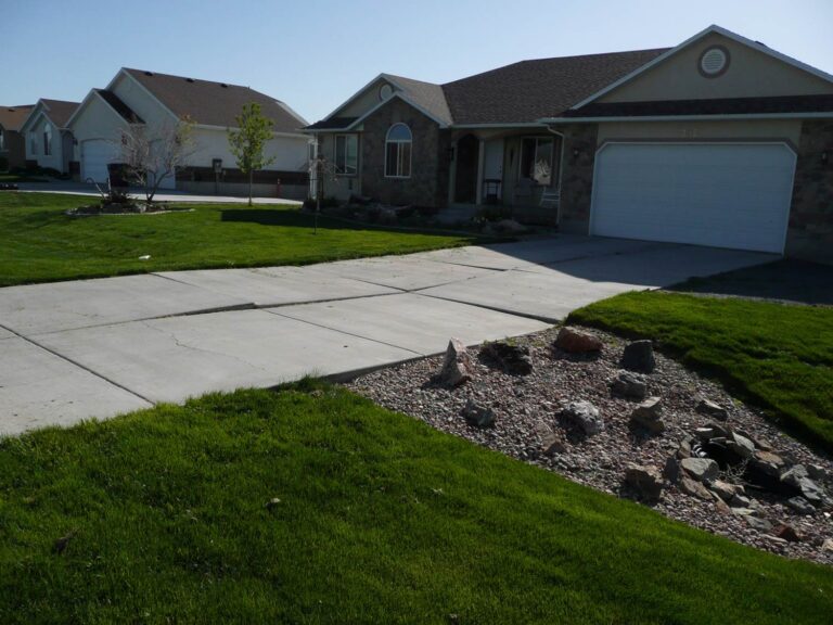 Settled concrete driveway before Utah concrete lifting in Grantsville